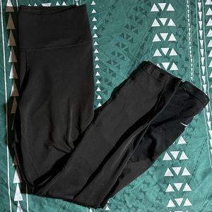 Nike Women’s black leggings with Nike sign on left lower leg